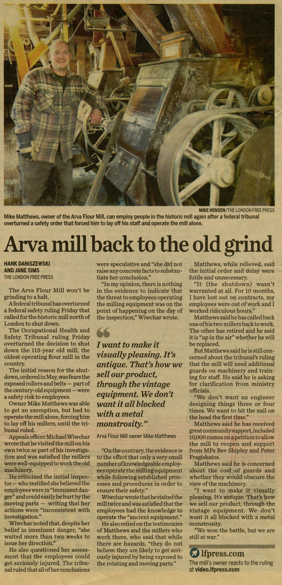 London Free Press article dated February 2017, headline 'Arva mill back to the old grind' — photo of Mike Matthews standing beside the vintage Goldie and McCulloch roller drivetrain inside the mill